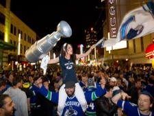 People pack Granville Street in celebration after the Vancouver Canucks advanced to the NHL's Stanley Cup Final after defeating the San Jose Sharks 4 games to 1 in Vancouver, B.C., on Tuesday May 24, 2011. (THE CANADIAN PRESS/Darryl Dyck)
