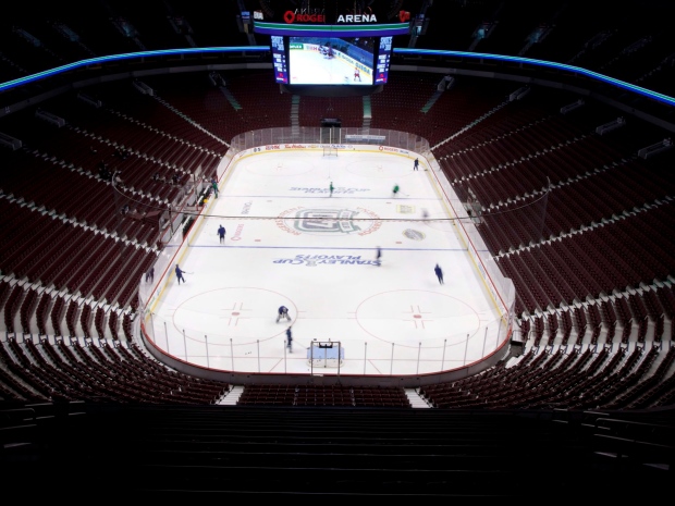 Members of the Vancouver Canucks are blurred as they take part in a team practice at Rogers Arena prior to game 2 of NHL Western Conference semi-final Stanley Cup playoff hockey action against the Nashville Predators in Vancouver, B.C., on Friday April 29, 2011. (THE CANADIAN PRESS/Jonathan Hayward)