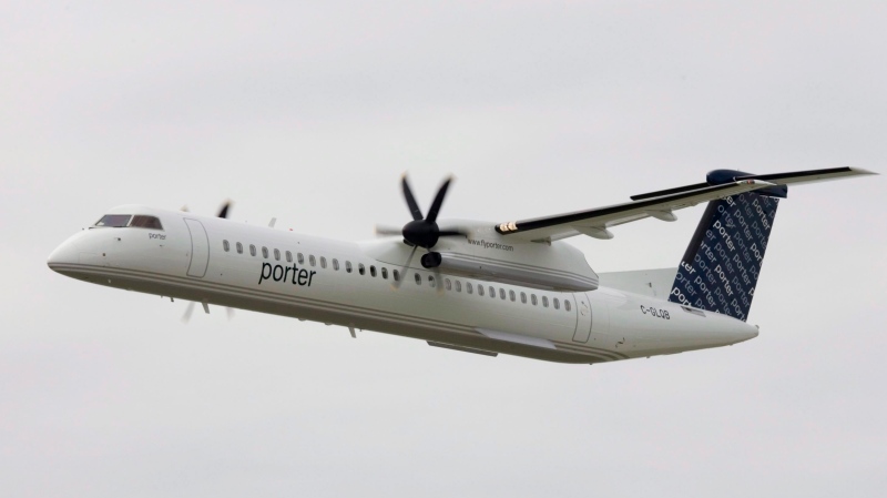 The first Porter Airlines plane does a fly past at the city centre airport in Toronto, Tuesday Aug. 29, 2006. (Adrian Wyld / THE CANADIAN PRESS)
