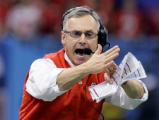 In a Jan. 4, 2011, file photo, Ohio State coach Jim Tressel signals for a timeout during the Sugar Bowl NCAA college football game against Arkansas at the Louisiana Superdome in New Orleans. Ohio State announced Monday, May 30, 2011 that football coach Jim Tressel has resigned as the NCAA investigates the Buckeyes for possible rules violations. Tressel says in a statement that he met with university officials and agreed that it is in Ohio State's best interest that he resign. The school says Luke Fickell, an assistant head coach under Tressel, will serve as interim head coach for the 2011-2012 season. (AP Photo/Patrick Semansky, File)