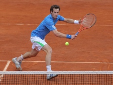 Andy Murray of Britain returns against Viktor Troicki of Serbia in the fourth round of the French Open tennis tournament in Roland Garros stadium in Paris, Tuesday May 31, 2011. Murray won the match in 5 sets 4-6, 4-6, 6-3, 6-2, 7-5. (AP Photo/Michel Euler)