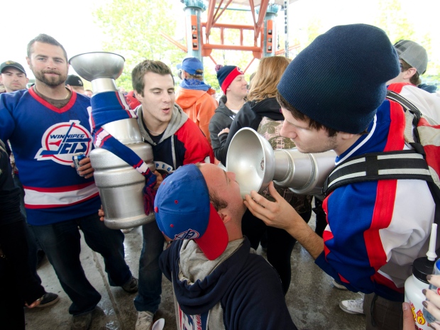 Winnipeg hockey supporters rally at The Forks in Winnipeg, Tuesday May 31, 2011 after the announcement that an NHL team will be returning to the city after 15 years. (THE CANADIAN PRESS/ David Lipnowski)