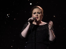 Adele performs on stage for the Brit Awards 2011 at The O2 Arena in London, Tuesday, Feb. 15, 2011. (AP Photo/Joel Ryan)
