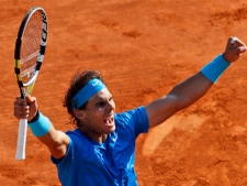 Spain's Rafael Nadal reacts as he defeats Sweden's Robin Soderling during their quarterfinal match of the French Open tennis tournament, at the Roland Garros stadium in Paris, Wednesday, June 1, 2011. Nadal won 6-4, 6-1, 7-6. (AP Photo/Christophe Ena)