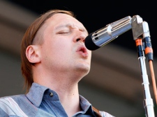 Arcade Fire lead singer Win Butler performs at the New Orleans Jazz and Heritage Festival in New Orleans, Friday, May 6, 2011. (AP Photo/Patrick Semansky)