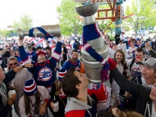 Winnipeg hockey supporters rally at The Forks in Winnipeg, Tuesday May 31, 2011 after the announcement that an NHL team will be returning to the city after 15 years. (THE CANADIAN PRESS/ David Lipnowski)