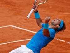 Rafael Nadal of Spain celebrates defeating Andy Murray of Britain in the semi final match of the French Open tennis tournament in Roland Garros stadium in Paris, Friday June 3, 2011. Nadal won in three sets, 6-4, 7-5, 6-4. (AP Photo/Christophe Ena)