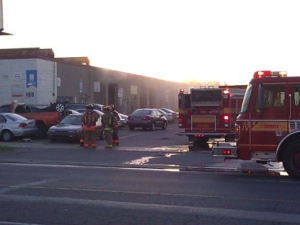 Firefighters at the scene of an autobody shop fire on Norfinch Drive on Friday, June 3, 2011. (CP24/Tom Stefanac)