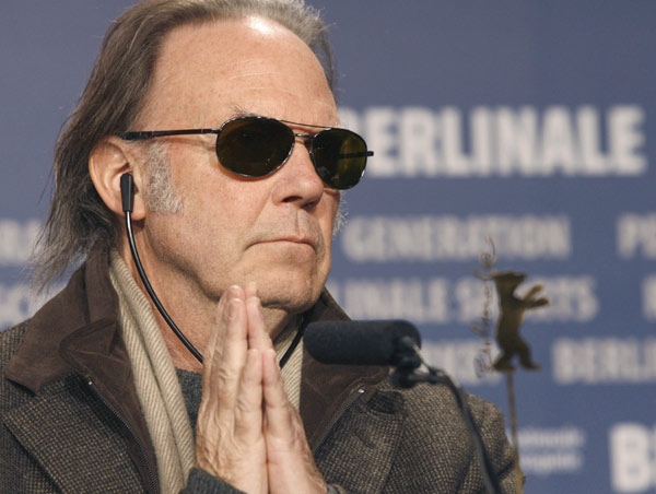 Singer songwriter Neil Young reacts during a news conference about his movie 'CSNY: Deja Vu' at the International Film Festival in Berlin, Germany, Feb. 8, 2008. (AP / Markus Schreiber)