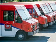 Canada Post vehicles sit idle outside a sorting depot in the borough of Ville St. Laurent in Montreal, Monday, June 6, 2011. THE CANADIAN PRESS/Graham Hughes