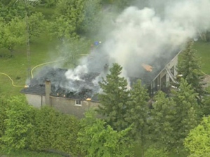 Smoke billows from a house fire on Healey Road, near Gore and Mayfield roads, in Caledon on Tuesday, June 7, 2011. 