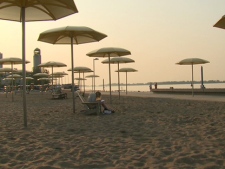 The sun rises over the urban beach at HtO Park in downtown Toronto on Wednesday, June 8, 2011. Environment Canada issued a humidex advisory and the city issued a heat alert because of a forecasted high of 33 C and humidex value of 40.