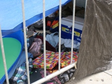Empty pizza boxes, blankets and pillows are seen under a makeshift tent in the MMVA lineup on June 9, 2011.(Sandie Benitah, CP24.com)
