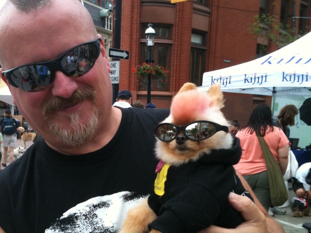 A man poses with his dog during Woofstock Saturday morning. The weekend festival draws 300,000 people and their pets to the city. (Jamie Gutfreund/CP24)
