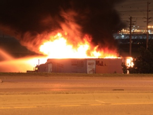 Firefighters battle a blaze at a Bramalea Road truck yard early Monday, June 13, 2011. (CP24/Tom Stefanac)