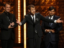 From left, Trey Parker, Matt Stone and Robert Lopez accept the award for Best Book of a Musical for "The Book of Mormon" during the 65th annual Tony Awards, Sunday, June 12, 2011 in New York. (AP Photo/Jeff Christensen)