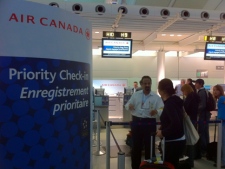 An Air Canada passenger checks in at Pearson International Airport on Tuesday, June 14, 2011, after 3,800 customer service agents walked off the job. (CP24/Tom Stefanac)