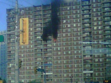 Black smoke billows out of a suite at an apartment building on White Oaks Court in Whitby on Wednesday, June 15, 2011. (Photo courtesy of Sarah Marmolejos)