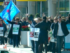 Air Canada workers picket at Lester. B. Pearson International Airport in Toronto on Wednesday, June 15, 2011.  