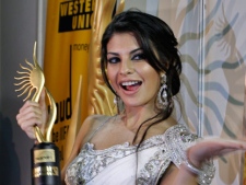 Sri Lankan born Bollywood actress Jacqueline Fernandez poses with the trophy at the International Indian Film Academy, or IIFA, awards event in Colombo, Sri Lanka, Saturday, June 5, 2010. (AP Photo/Eranga Jayawardena)
