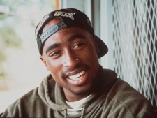 This is a 1993 file photo, of Tupac Shakur . New York City police have begun an investigation into an online posting supposedly from a convicted felon who claims to have shot and robbed slain rapper Tupac Shakur. Police spokesman Paul Browne said Wednesday June 15, 2011 if police determine the post is legitimate they will seek to interview the prisoner. (AP Photo/FILE)
