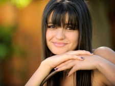 In this April 15, 2011 photo, teen pop singer Rebecca Black poses for a portrait in Los Angeles. Black�s official �Friday� music video has gotten down off YouTube. The page where the video starring the 13-year-old singer once played now says it �is no longer available due to a copyright claim by Rebecca Black.� Black�s spokesman says her team sent �a takedown notice to YouTube as a result of the dispute we have with Ark Music regarding the �Friday� video.� (AP Photo/Chris Pizzello)