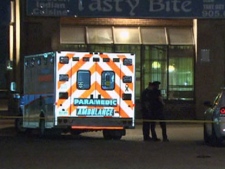 An ambulance is parked at the scene of a homicide on Torbram Road in Mississauga on Monday, June 20, 2011. A man died in a fight at a restaurant, police said.