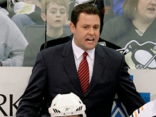In this April 9, 2009 file photo, New York Islanders coach Scott Gordon works behind the bench during the first period against the Pittsburgh Penguins in a NHL game in Pittsburgh. (AP Photo/Gene J. Puskar, File)