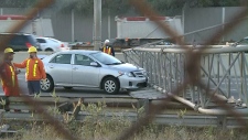Crash knocks over sign on Gardiner Expressway