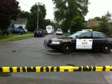 Police have cordoned off the site of a fatal shooting in Lindsay, Ont. on June 22, 2011. A police officer was also seriously injured during the incident. (Spencer Gallichan-Lowe/CP24)