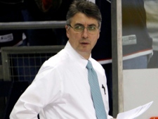 Claude Noel watches the Columbus Blue Jackets warm up while he was the NHL team's coach Sunday, Feb. 14, 2010. Noel will coach Winnipeg's new NHL team, according to the Winnipeg Free Press. (THE CANADIAN PRESS/AP-Terry Gilliam)