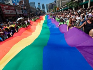 People take part in the Pride Parade in Toronto on Sunday, July 4, 2010. (THE CANADIAN PRESS/Adrien Veczan)