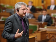 New Democratic Party MP Charlie Angus speaks in the House of Commons as his party continues their filibuster on the government back-to-work legislation on Parliament Hill in Ottawa on Friday, June 24, 2011. THE CANADIAN PRESS/Sean Kilpatrick
