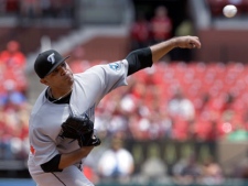 Toronto Blue Jays starting pitcher Ricky Romero throws during the first inning of an interleague baseball game against the St. Louis Cardinals on Sunday, June 26, 2011, in St. Louis. (AP Photo/Jeff Roberson)
