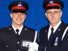 In this police handout photo, York Regional Police Const. Garrett Styles is seen with his father, retired Staff Sgt. Garry Styles at his badge ceremony in 2004.