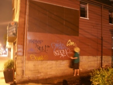 A graffiti writer, leaves his mark in Toronto's Little Portugal neighbourhood. (Paul Johnston, CP24.com)