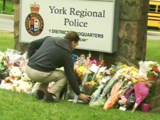 Residents of York Region leave flowers next to the site where Const. Garrett Styles was killed this week.