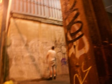 A graffiti writer, leaves his mark in an alleyway in Toronto's Little Portugal neighbourhood. (Paul Johnston, CP24.com)