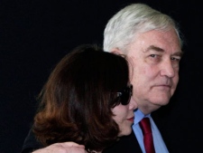 Conrad Black and his wife Barbara Amiel Black leave federal court in Chicago, Friday, June 24, 2011. (AP Photo/M. Spencer Green)