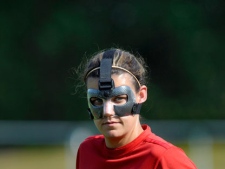 Canada's Christine Sinclair wears a protective mask during a training session in Bochum, Germany, Tuesday, June 28, 2011. Sinclair broke her nose in the opening group A match against Germany. (AP Photo/dapd, Sascha Schuermann)