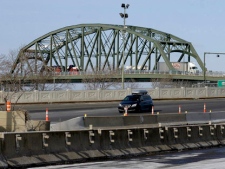 A vehicle approaches the U.S. Customs and Border Protection plaza after crossing the Peace Bridge from Canada into Buffalo, N.Y. on Thursday, Jan. 31, 2008. (AP Photo/Don Heupel)