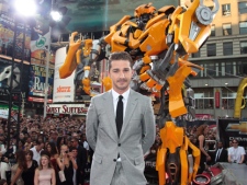 In this photo provided by StarPix, Shia LaBeouf poses for photographs at the premiere of "Transformers: Dark of the Moon" Tuesday, June 28, 2011, in New York's Times Square. (AP Photo/StarPix, Dave Allocca)