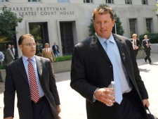 Roger Clemens, right, leaves federal court in Washington, Tuesday, July 5, 2011. (AP Photo/Alex Brandon)