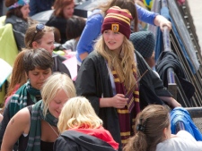 Harry Potter fan, Lauren Furness, 16, centre right, in hat, from Nottinghamshire, joins fans waiting at Trafalgar Square, London, a day before the World Premiere of Harry Potter and The Deathly Hallows: Part 2, the last film in the series, Wednesday, July 6, 2011. (AP Photo/Joel Ryan)