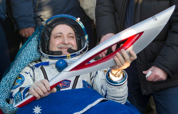 Olympic torch returns home from space station