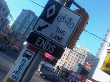 A sign warns cyclists about the end of a bike lane on Jarvis Street in this Wednesday, July 13, 2011 photo. (CP24/Cam Woolley)