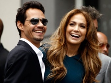 Jennifer Lopez, right, and her husband Marc Anthony laugh before a Hollywood Walk of Fame star ceremony for entertainment producer Simon Fuller in Los Angeles, Monday, May 23, 2011. Fuller is the creator of "American Idol". (AP Photo/Matt Sayles)