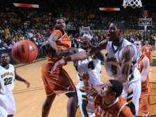 Texas' Tristan Thompson, center left, and Cory Joseph, bottom, and Baylor's Quincy Acy (4) and Baylor 's Perry Jones (5) compete for a rebound in the first half of an NCAA college basketball game, Saturday, March 5, 2011, in Waco, Texas. (AP Photo/Tony Gutierrez)
