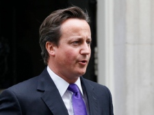 Britain's Prime Minister David Cameron leaves Downing Street in London, Wednesday, July 20, 2011. The Prime Minister will make a statement ahead of a debate at the House of Commons regarding the News International phone hacking scandal. (AP Photo/Kirsty Wigglesworth)