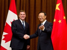 Canadian Foreign Minister John Baird, left, is greeted by his Chinese counterpart Yang Jiechi during his visit to China's Foreign Ministry office in Beijing, China, Monday, July 18, 2011. (AP Photo/Andy Wong)